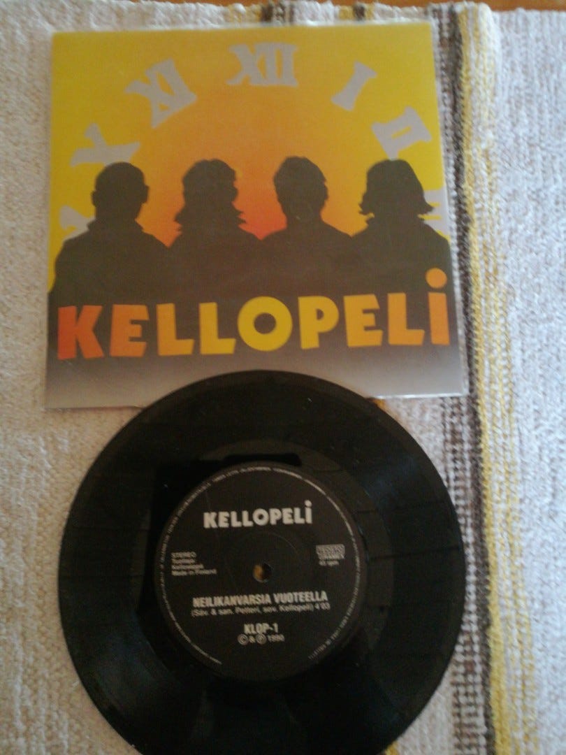 Kellopeli 7 Neilikanvarsia vuoteella