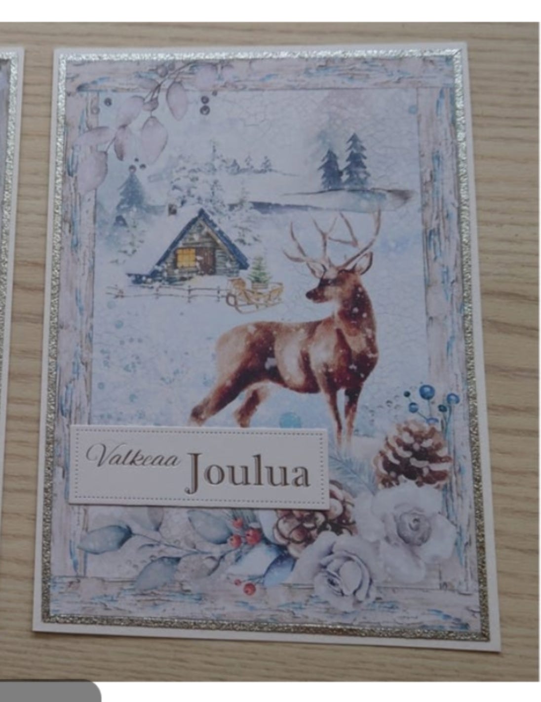 Joulukortti Poro ja käpy