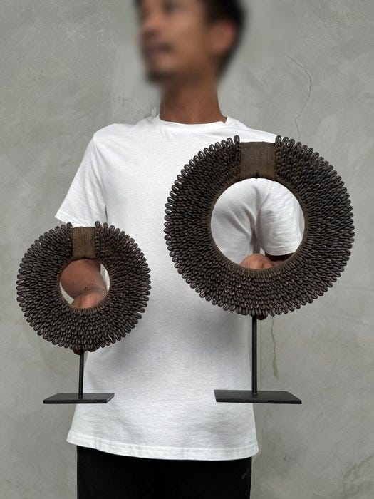 Pair of Dark Brown/Black Colored Tolai Necklaces on custom stands