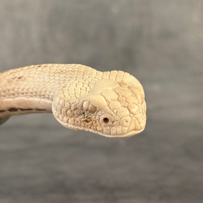 Kaiverrus, Stunning Snake Head Carving from a Deer Antler on a cu
