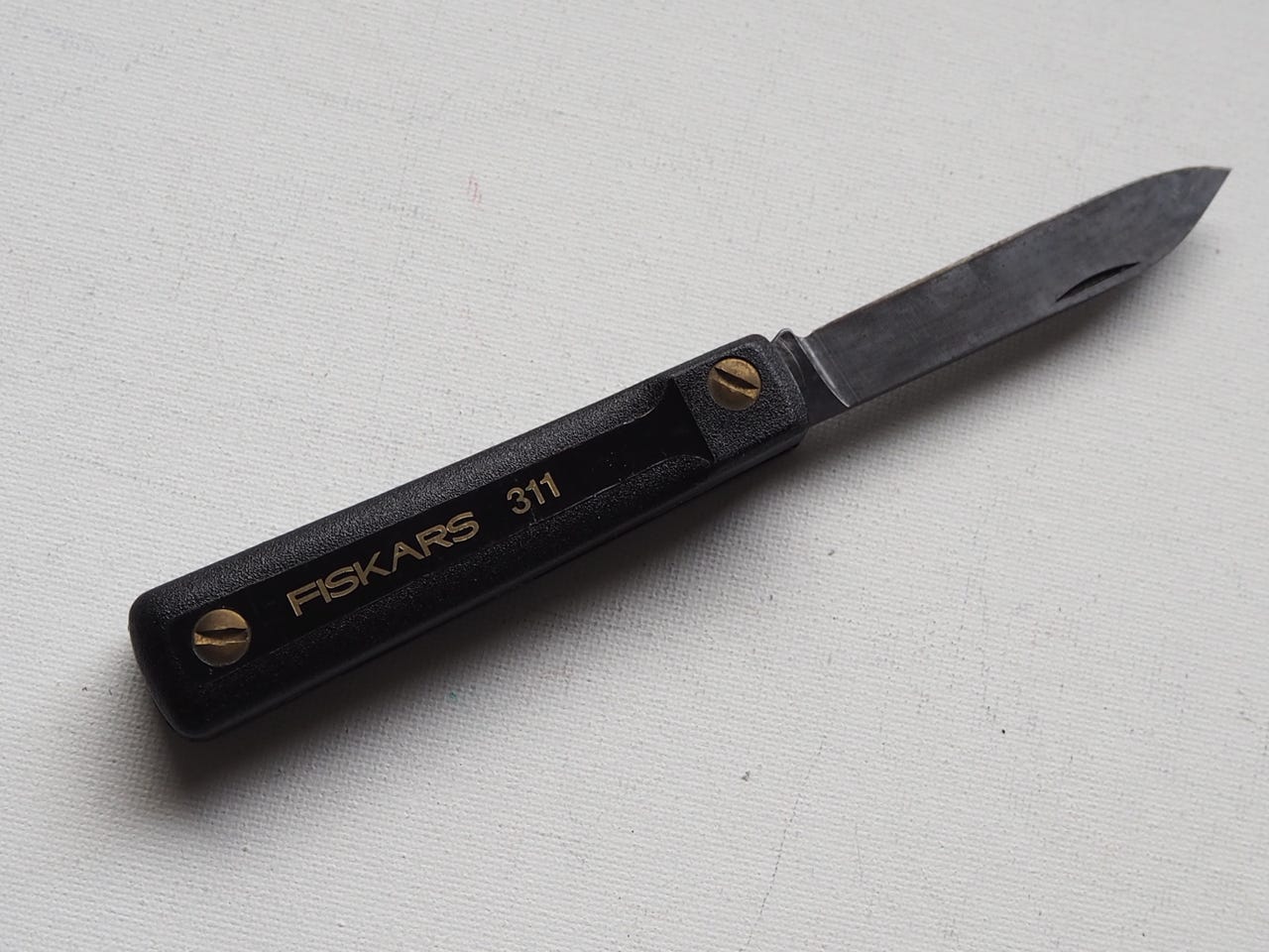 Fiskars linkkuveitsi 80 luvulta,postikuluineen pakettina.