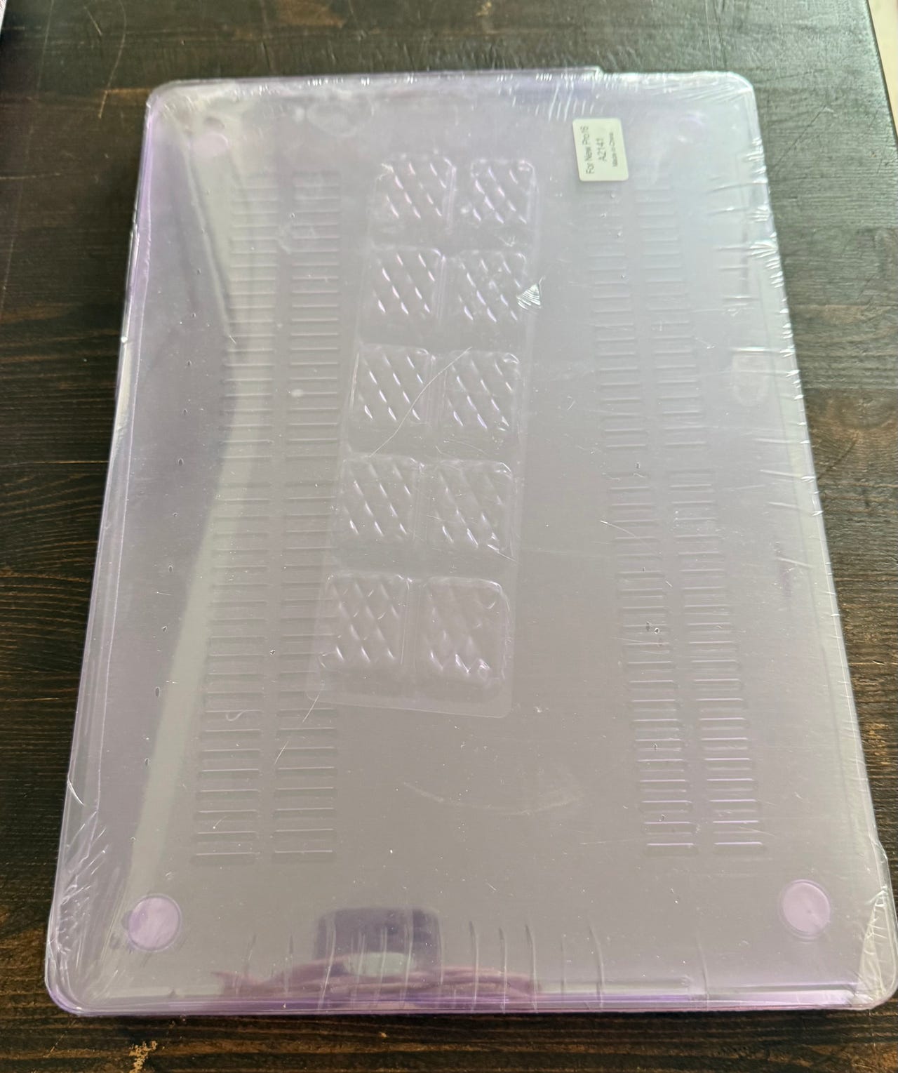Läppärin kovakotelo violetti, uusi pakkauksessa