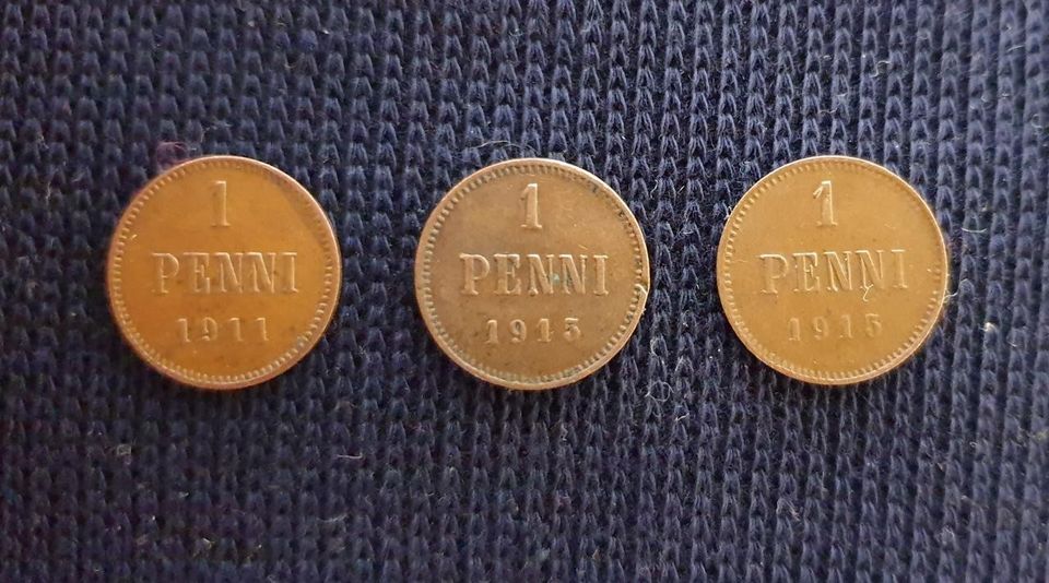 1 pennin kolikot 1911 ja 1915