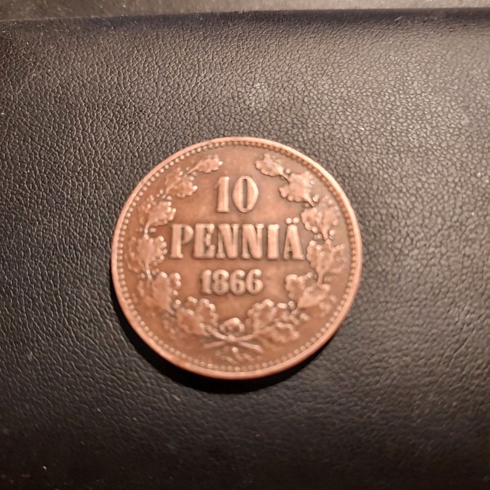 10 pennin kolikko.