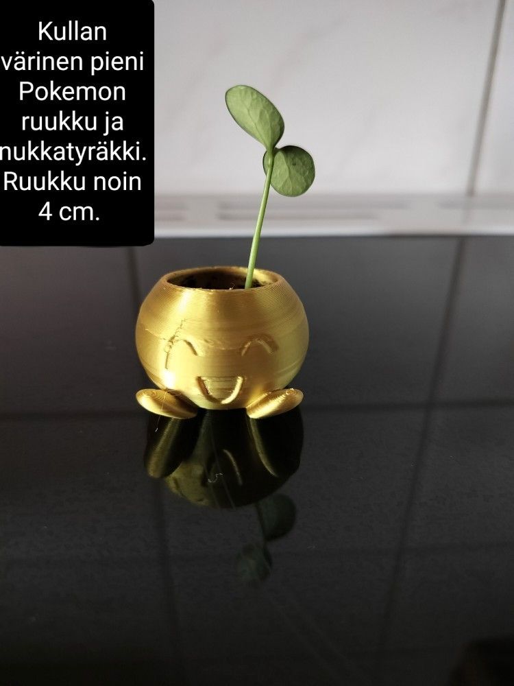 Nukkatyräkki pienessä kultaisessa Oddish ruukussa