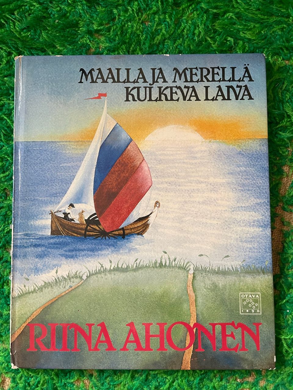 Maalla ja merellä kulkeva laiva kirja