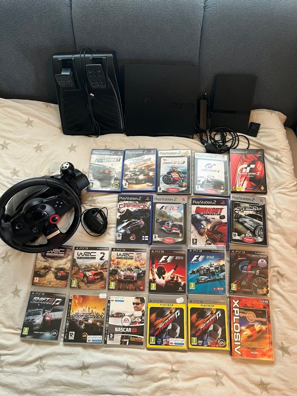 PS3, PS2, Lochitec ohjaimet (ratti+polkimet) ja 20 peliä