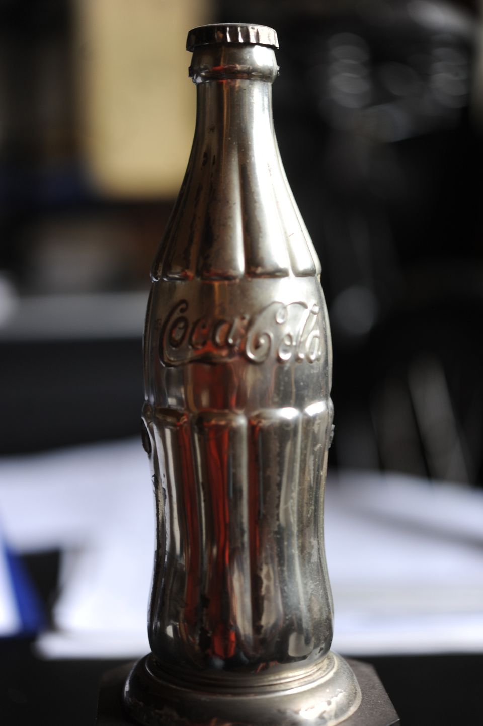 Coca Cola pullo metalli