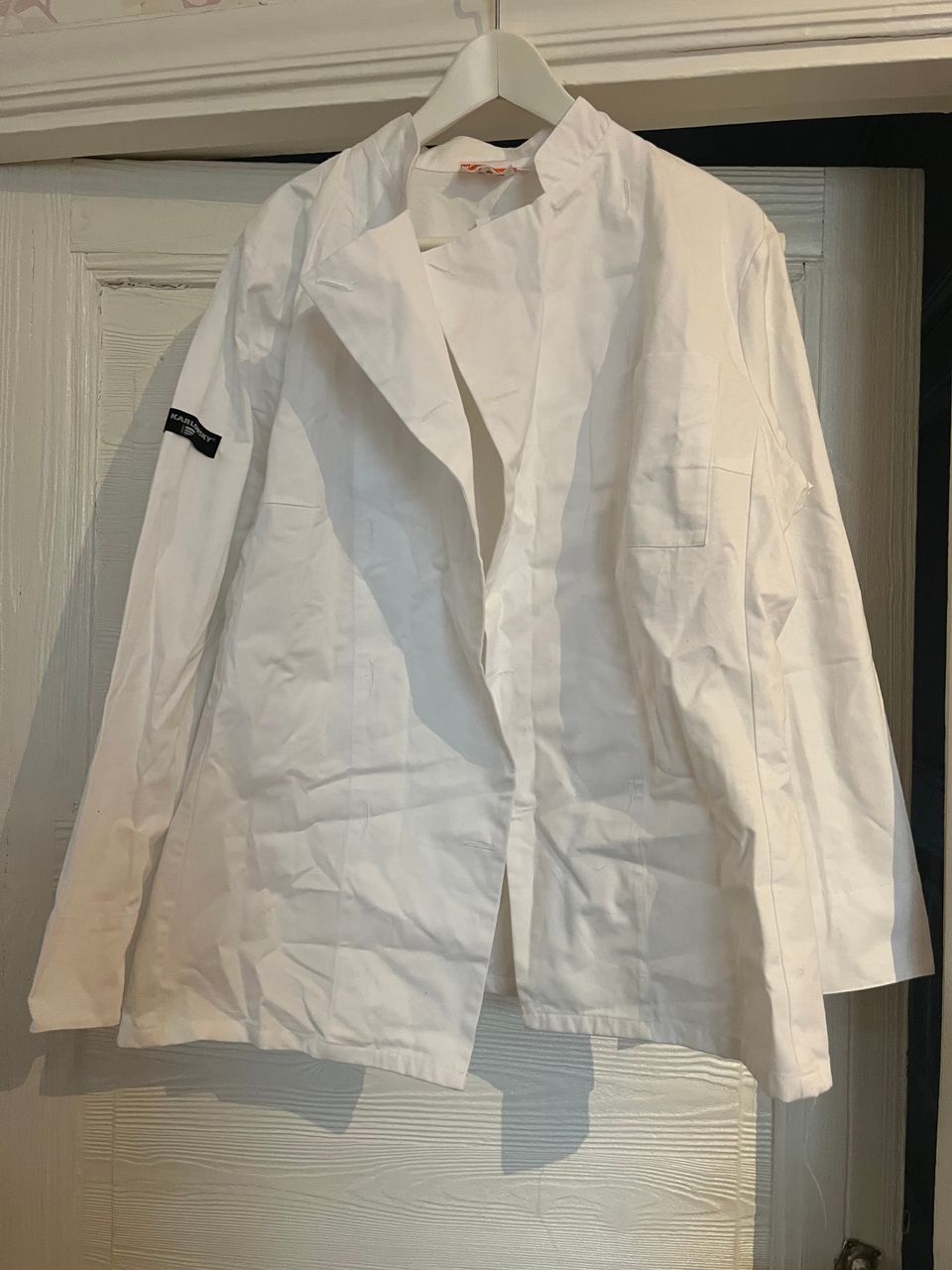 Käyttämätön valkoinen kokin takki