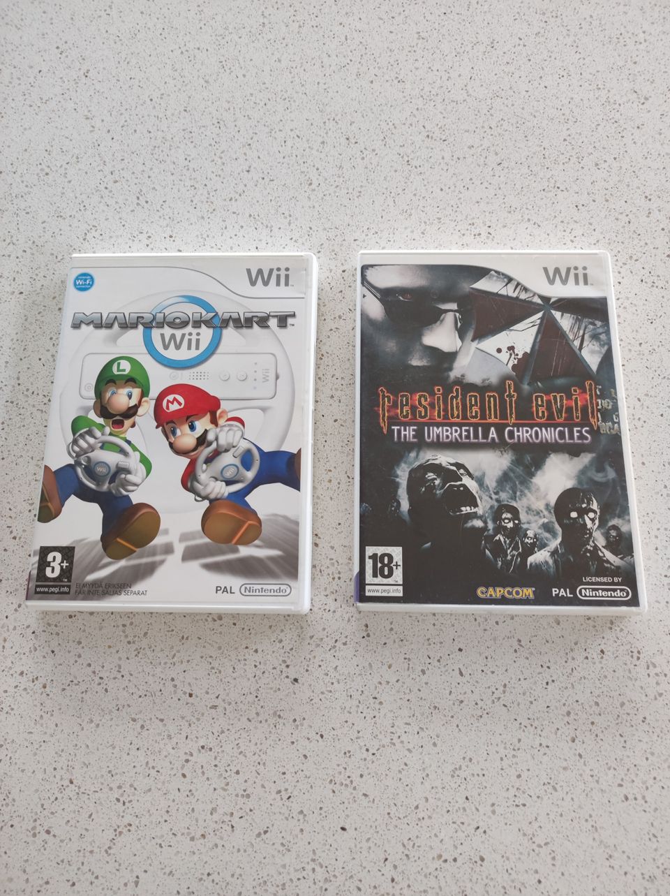 Wii Mario Kart ja resident evil pelit