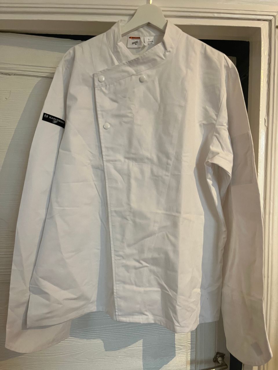 Käyttämätön valkoinen kokin takki