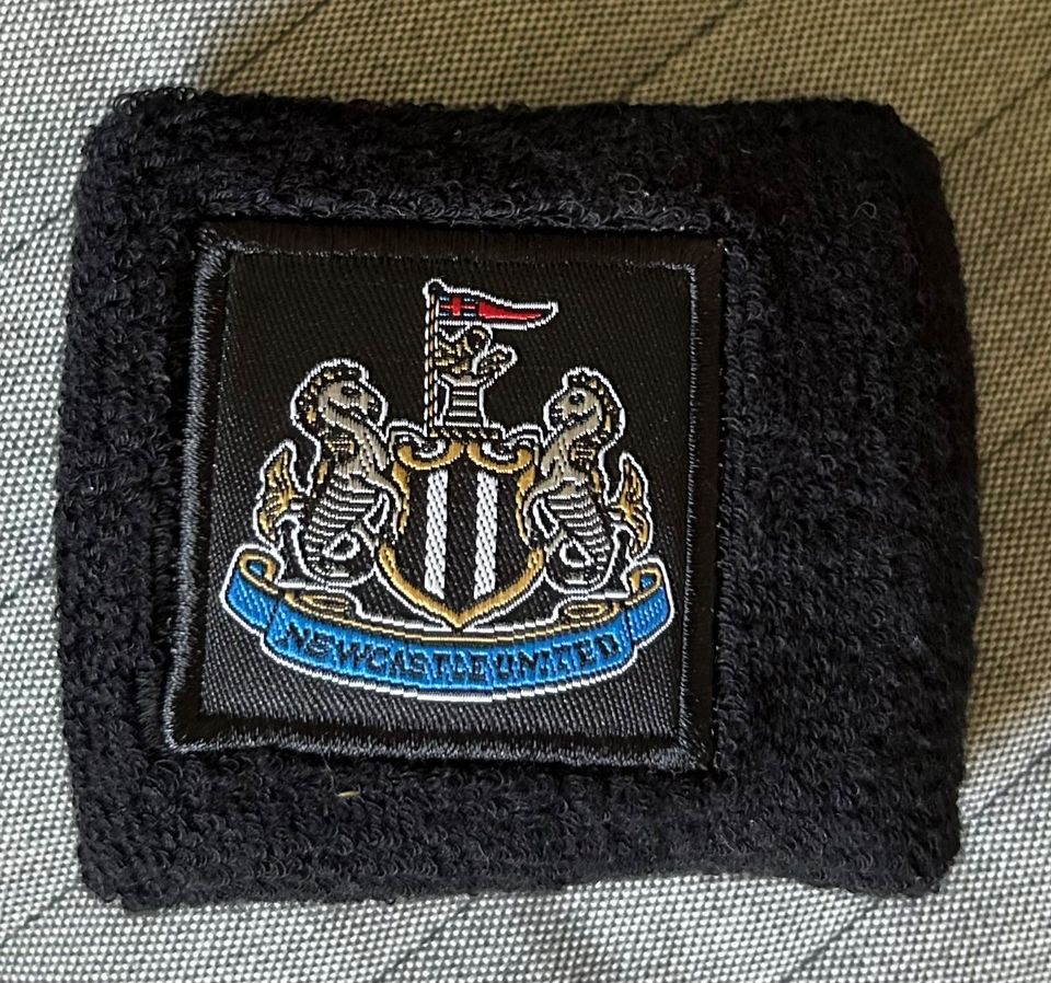 Newcastle United hikinauha unisex frotee puuvilla ranne