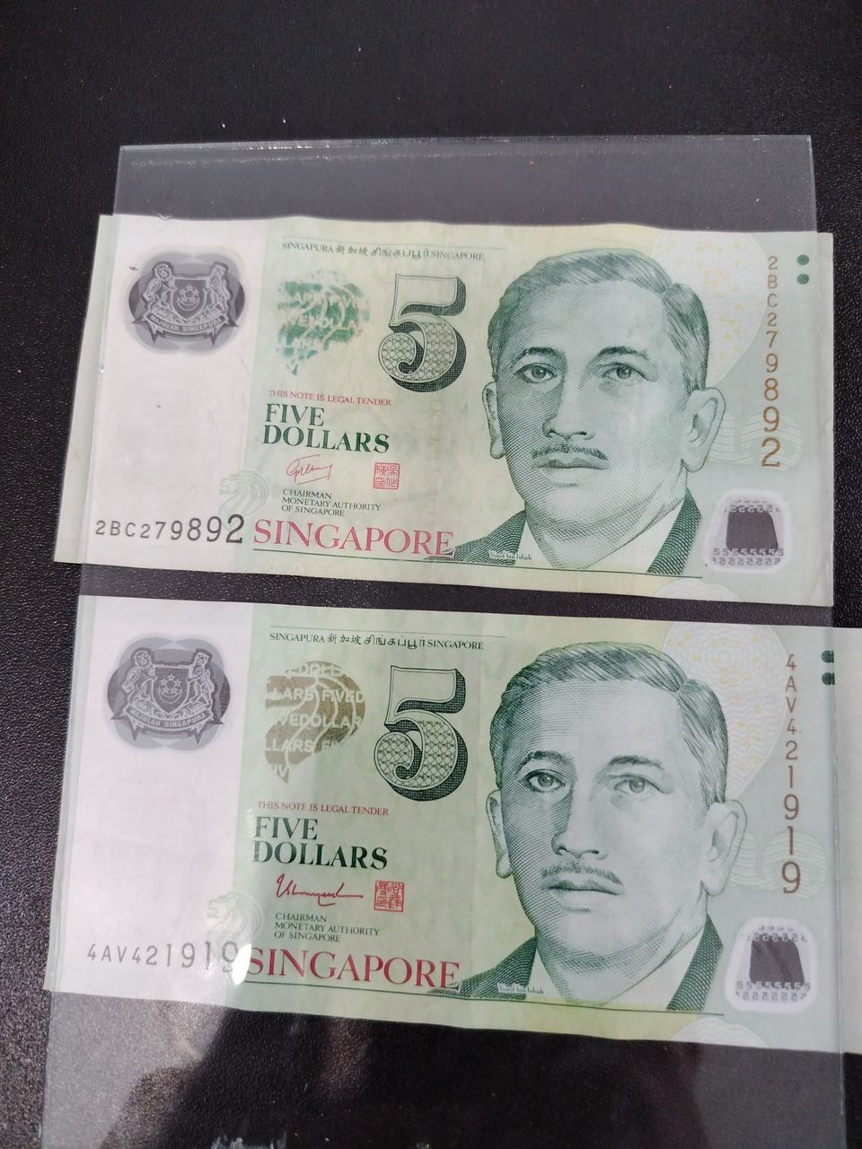 setelit - 5 Singaporen dollaria