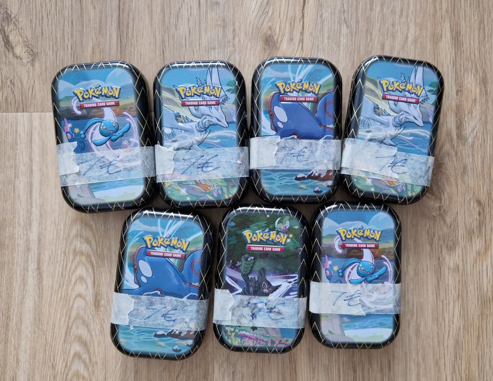 Pokemon Mini tin täynnä pokemonkortteja