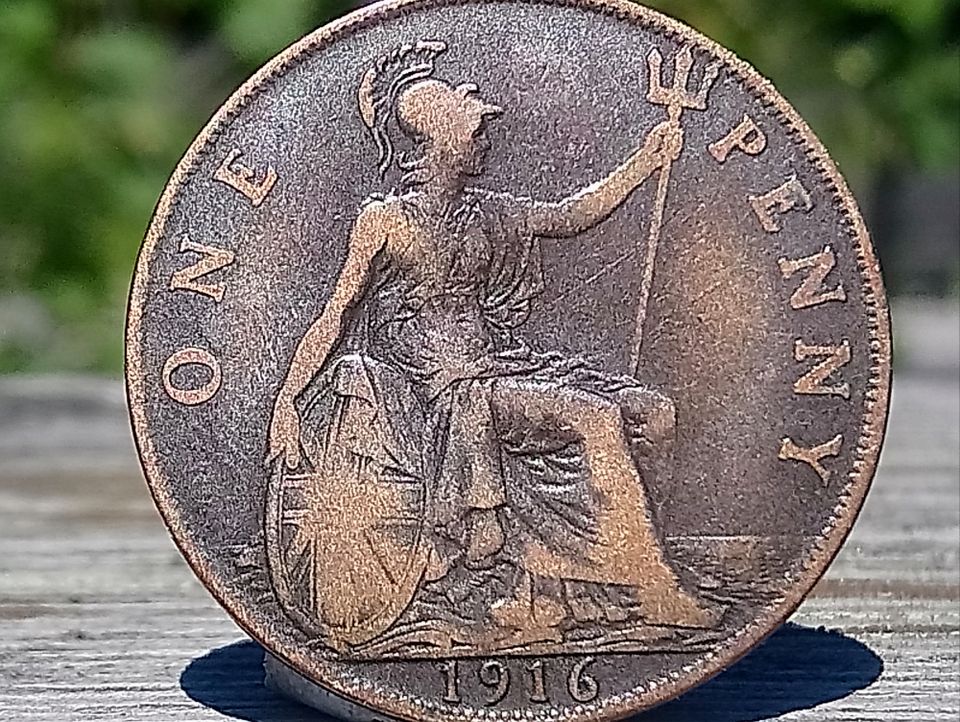Pronssivärinen kolikko One Penny 1916