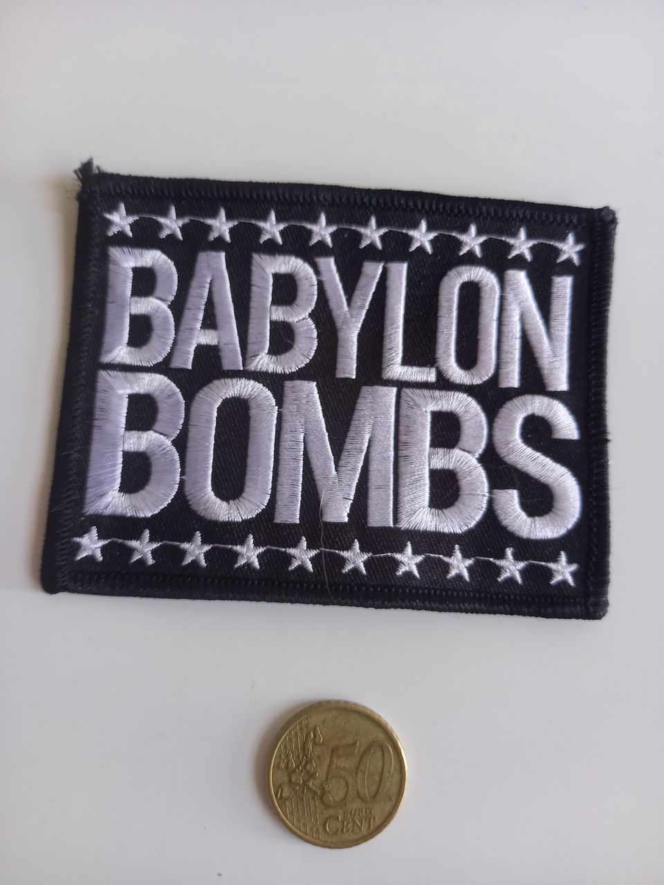 Babylon Bombs hihamerkki