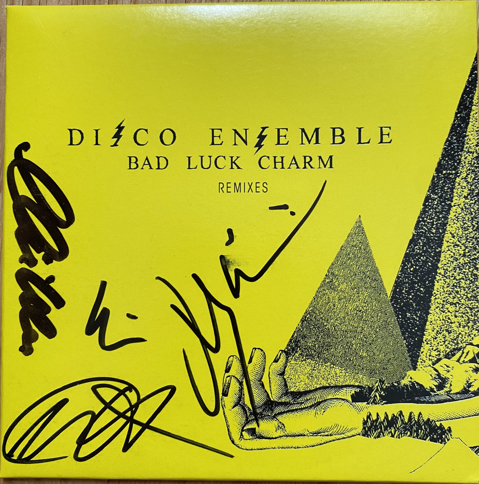 Disco Ensemble – Bad Luck Charm Remixes CD-single bändin nimikirjoituksilla