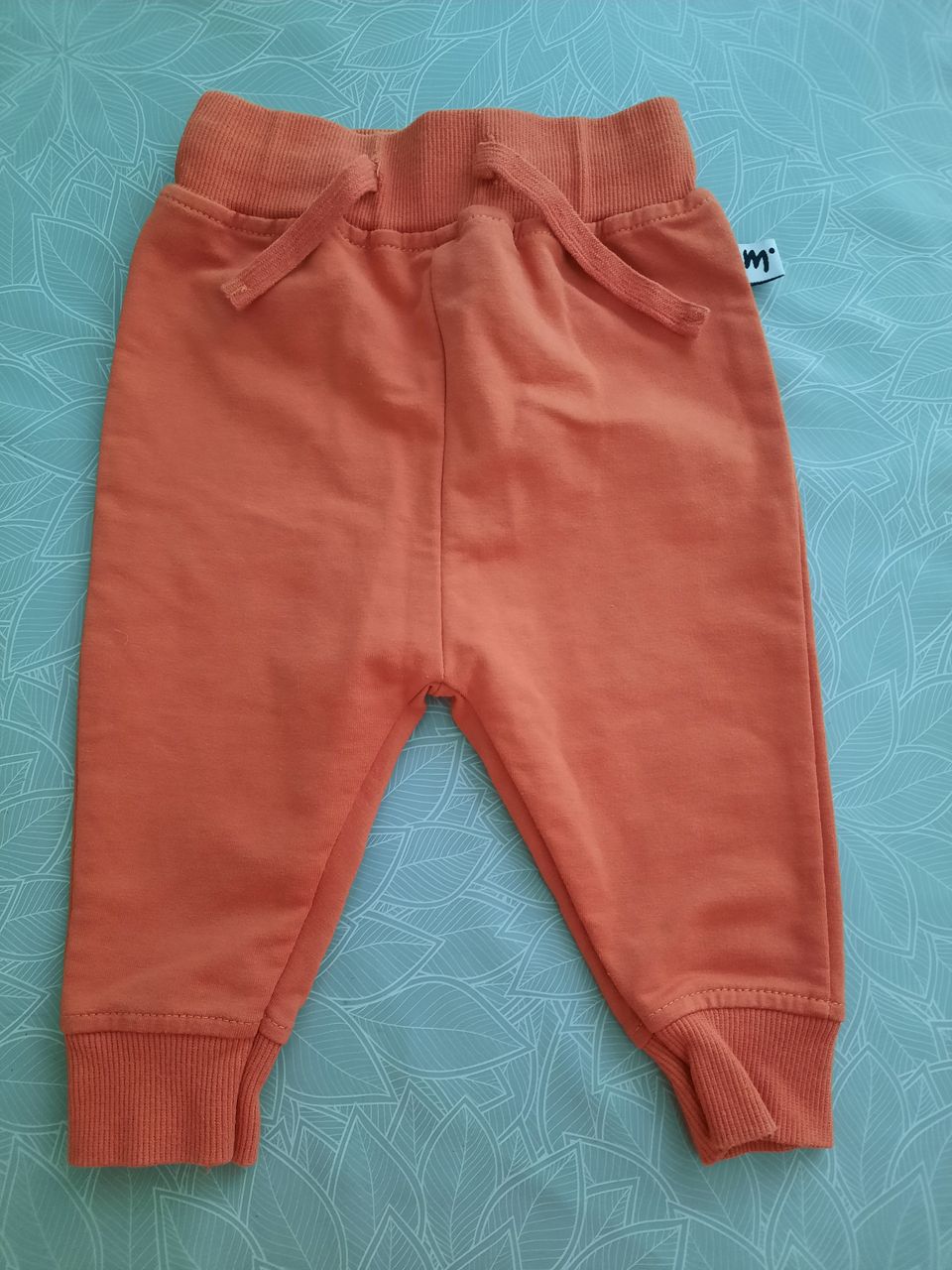 Oranssinpunaiset Martinex housut koko 62
