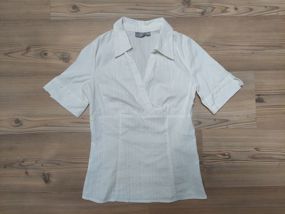 Valkoinen lyhythihainen paitapusero