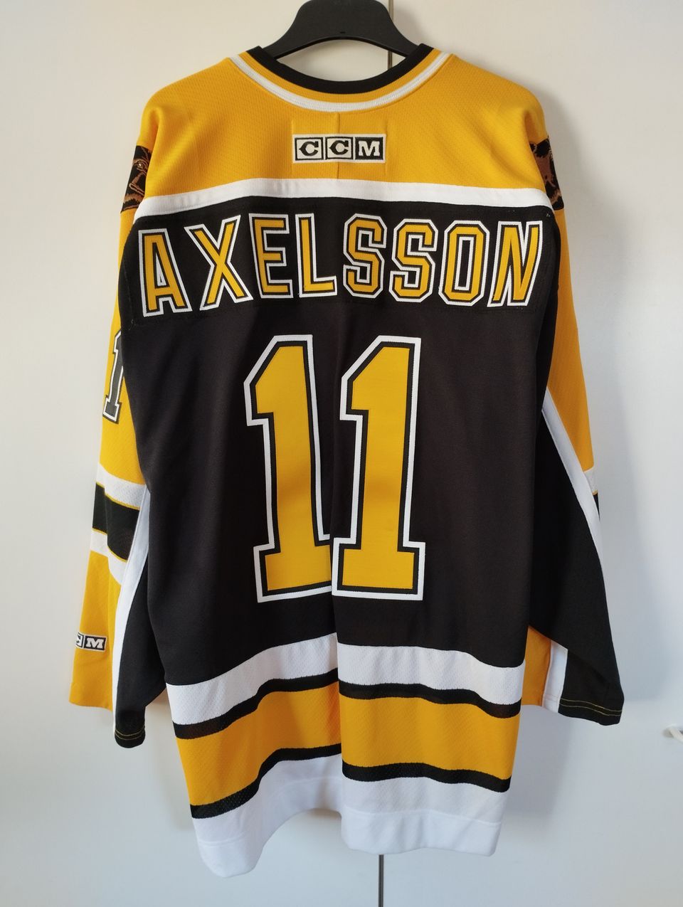 Aito Boston Bruins fanipaita Axelsson #11