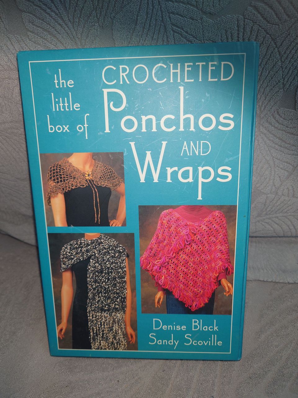 The little box of crocheted ponchos and wraps