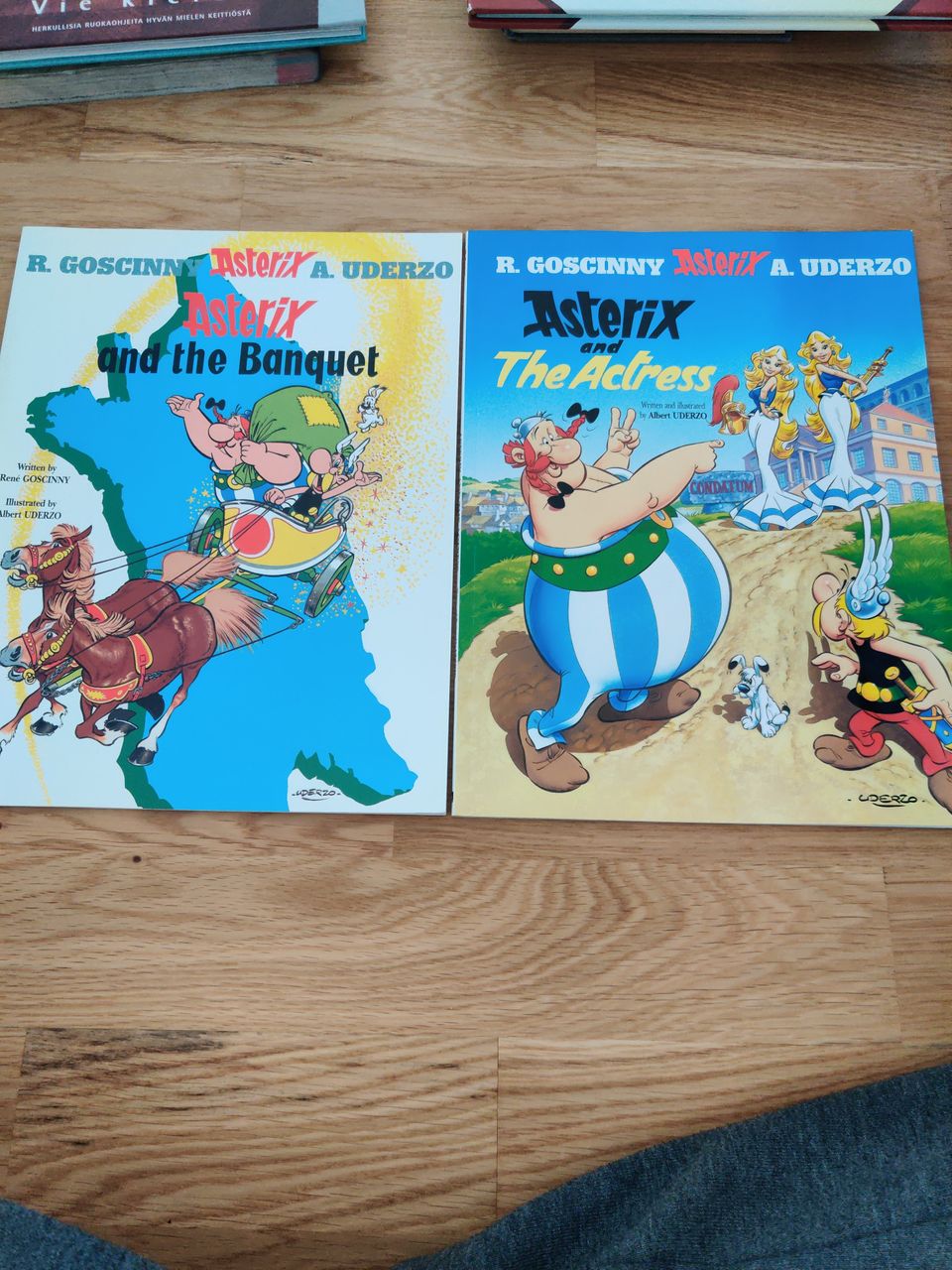 Asterix and The banquet ja axterix and actress kirjat. English