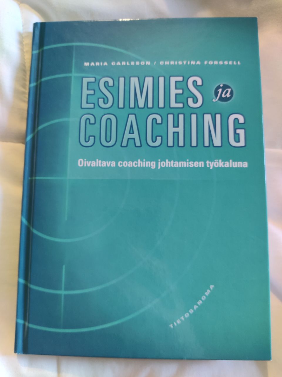 Esimies ja coaching-kirja