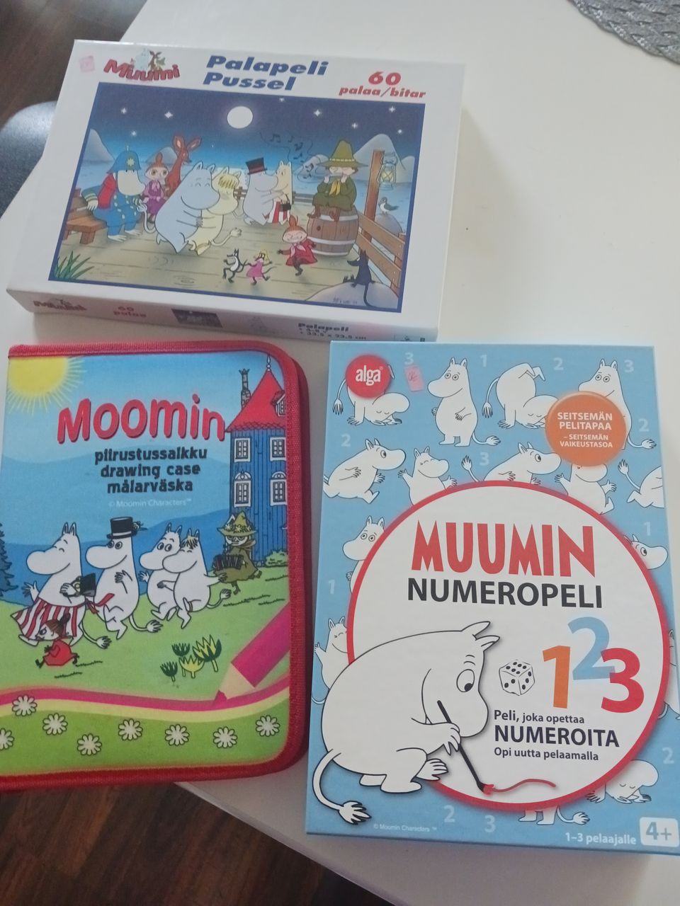 Muumin piirrosrussalkku, Muumin numeropeli 123, sekä Muumi palapeli 60 palaa