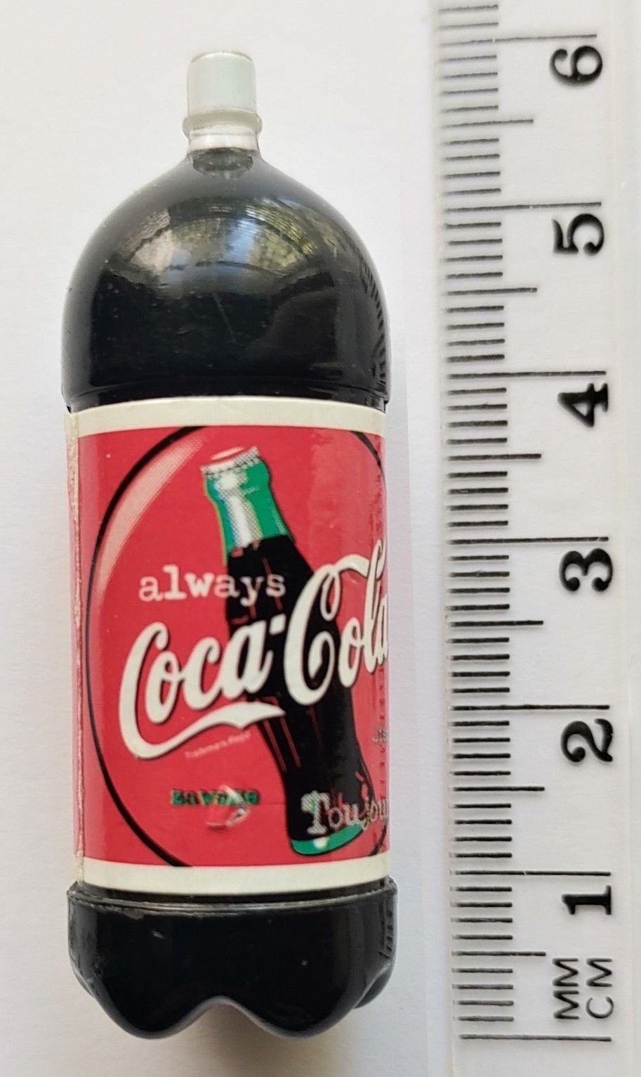 Nukkekodin Coca-Cola pullo