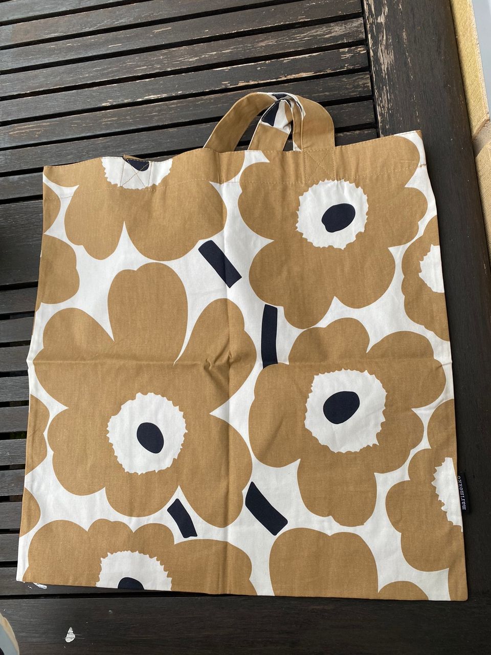 marimekko ruskeat kukat kangas kassi