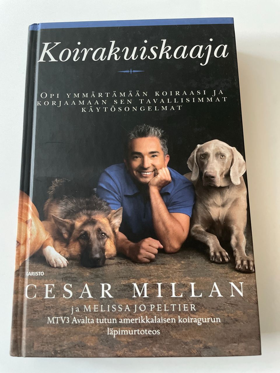 Cesar Millan: Koirakuiskaaja -kirja