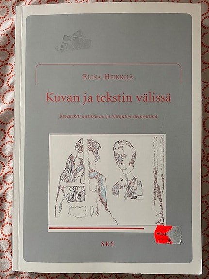 Kuvan ja tekstin välissä