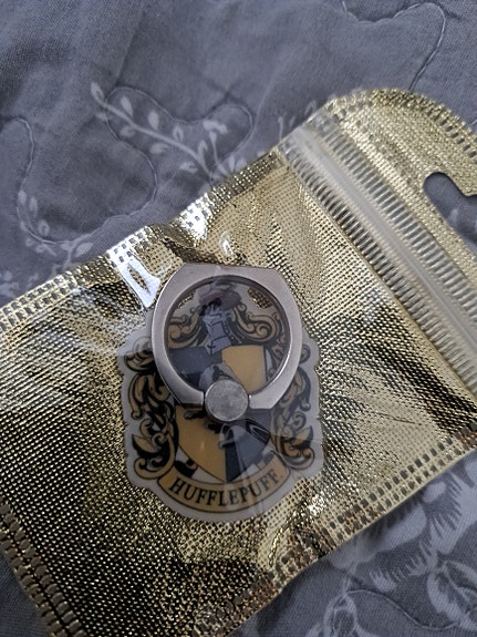 Hufflepuff puhelin sormipidike