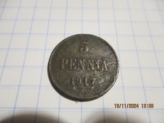 5 pennin kolikko
