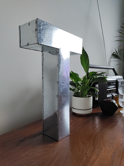 T-kirjain (Metalvetica)