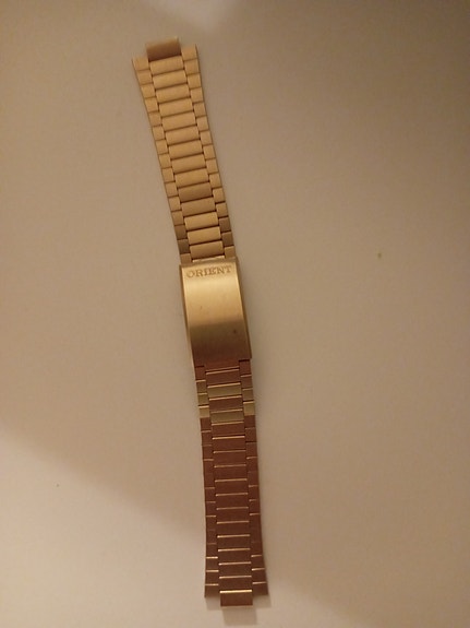 Orient kellon kultainen ranneke