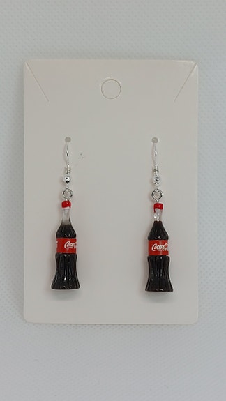 Coca cola- pullo korvakorut