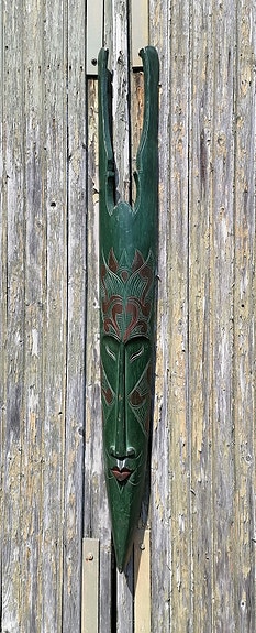 Näyttävä vihreä toteemi seinälle