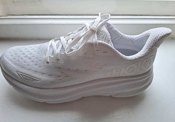White HOKA CLIFTON women running shoes.