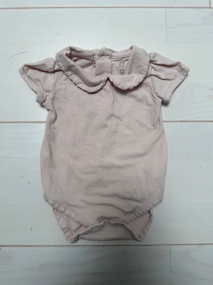 Lyhythihainen body, 62