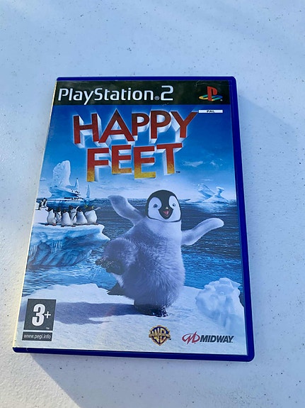 PlayStation 2 -konsolin Happy Feet -peli. Julkaistu v2006