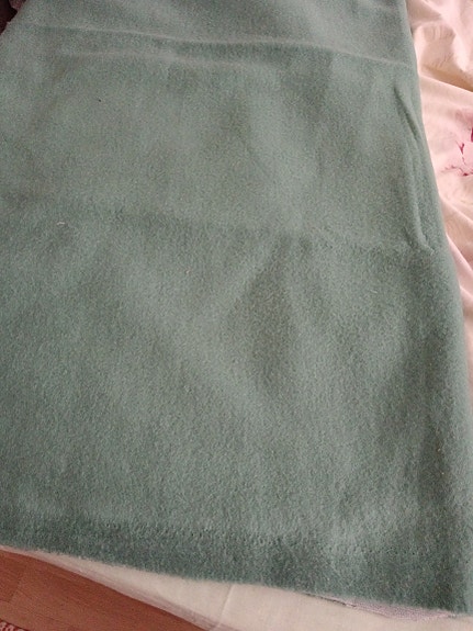 Fleece tyylinen Vihreä kangas.
