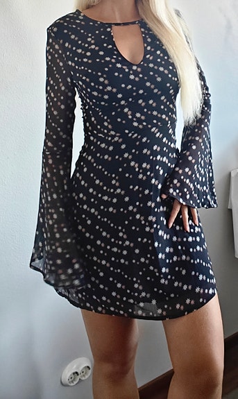Skater dress with flute sleeve in black star print