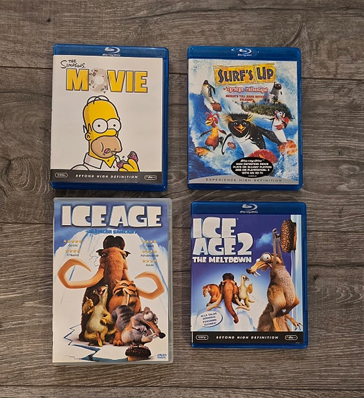 Blu-ray/ DVD elokuvat The Simpsons Movie, Surf's Up, Ice Age ja Ice Age 2