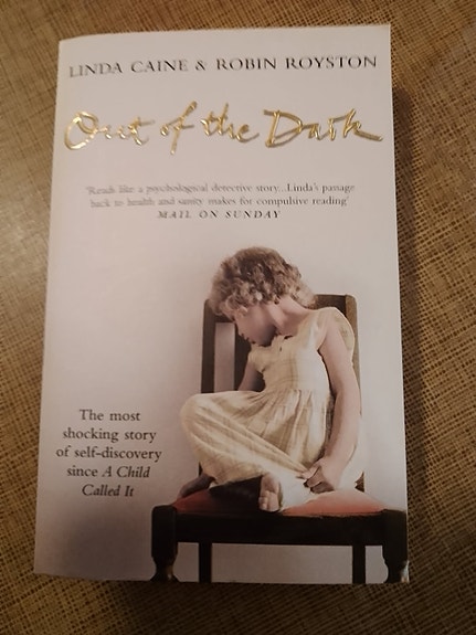 "Out of the Dark" by Linda Caine, book in English