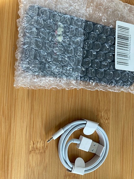 Iphone SE 2020 on box with a new cable
