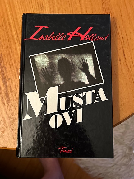 Isabelle Holland Musta Ovi kirja