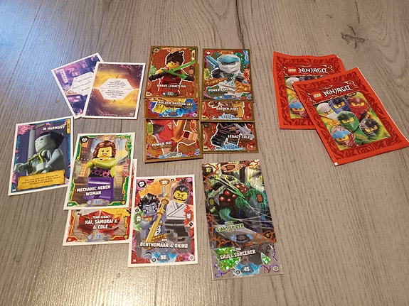 14 LEGO Ninjago cards and 2 unopened pack