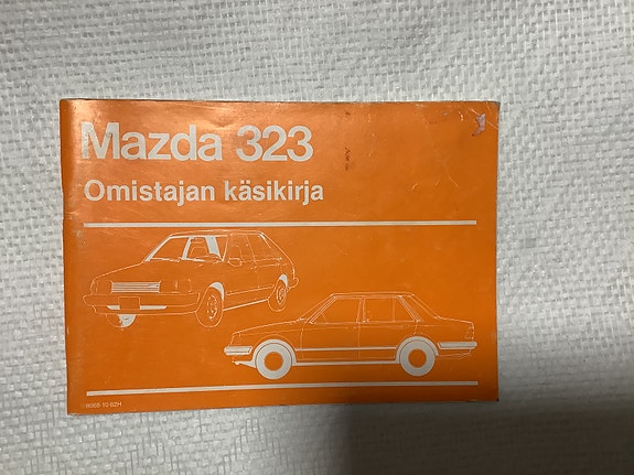 Omistajan käsikirja Mazda 323 V.1984
