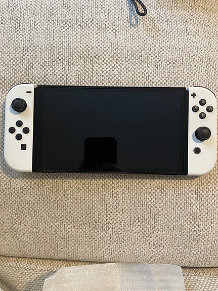 Nintendo switch oled + zelda botw ja kuljetuskotelo